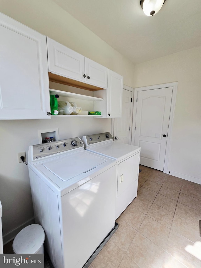 7677 Green Ridge Ln, Abbottstown, PA 17301 - washroom featuring washer and dryer, cabinet space, light tile patterned flooring, and baseboards