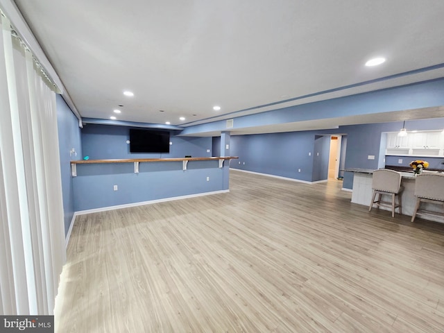 7677 Green Ridge Ln, Abbottstown, PA 17301 - unfurnished living room with light wood-type flooring, baseboards, and recessed lighting