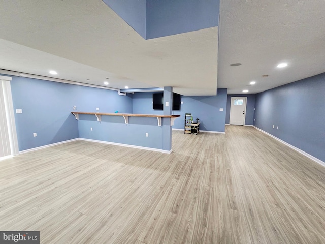 7677 Green Ridge Ln, Abbottstown, PA 17301 - unfurnished living room with light wood-type flooring, baseboards, and recessed lighting