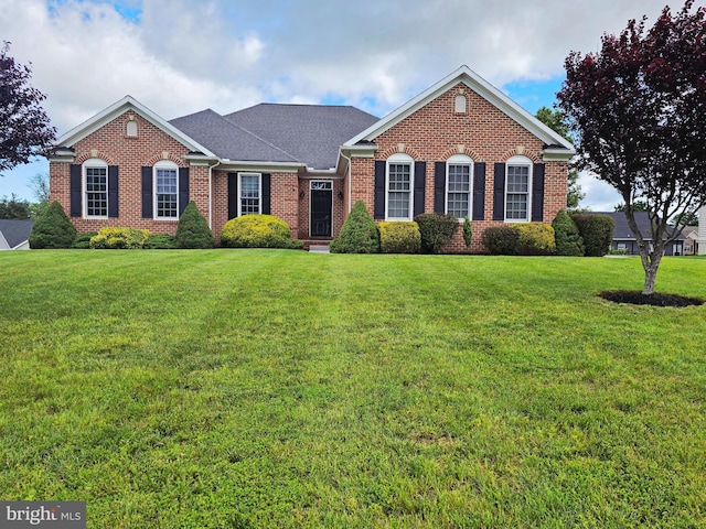 7677 Green Ridge Ln, Abbottstown, PA 17301 - view of front facade with brick siding, a front yard, and roof with shingles