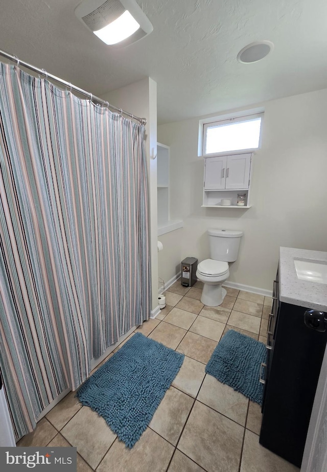 7677 Green Ridge Ln, Abbottstown, PA 17301 - bathroom featuring vanity, tile patterned floors, toilet, a textured ceiling, and a shower with shower curtain