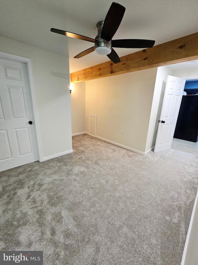7677 Green Ridge Ln, Abbottstown, PA 17301 - empty room with carpet floors, ceiling fan, beamed ceiling, and baseboards