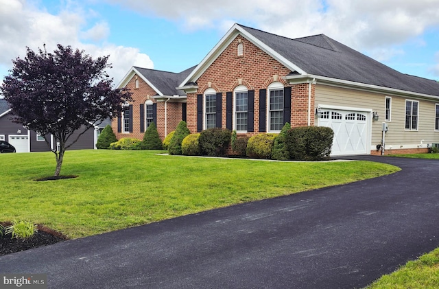 7677 Green Ridge Ln, Abbottstown, PA 17301 - view of front of property with brick siding, an attached garage, a front lawn, driveway, and roof with shingles