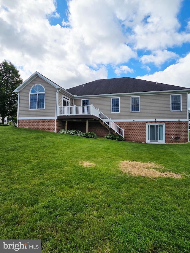 7677 Green Ridge Ln, Abbottstown, PA 17301 - back of house featuring a wooden deck, a lawn, stairs, and brick siding