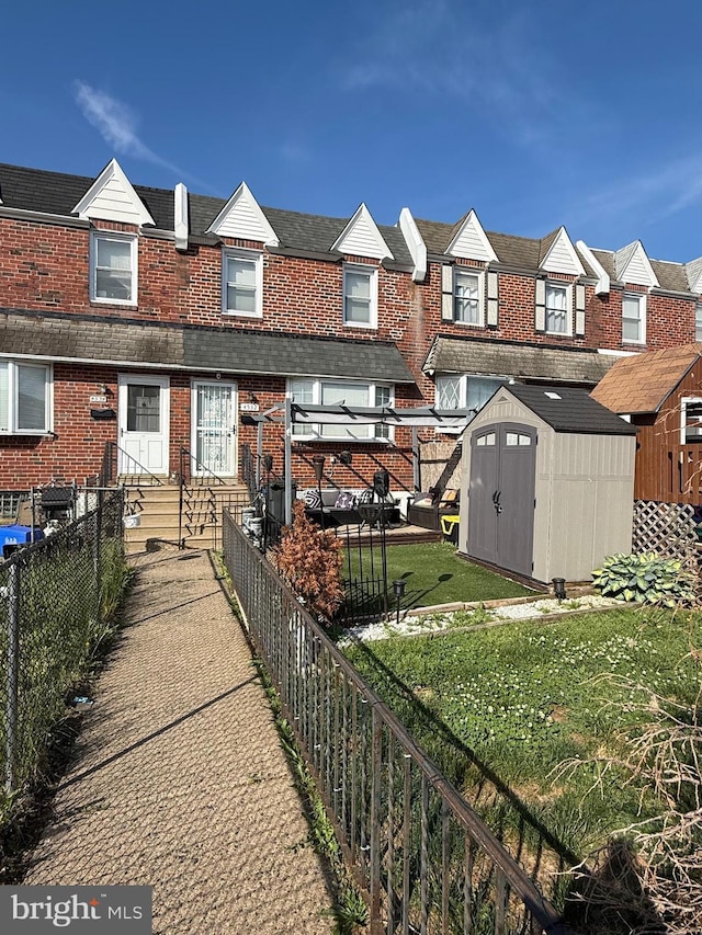 4532 Pennypack St, Philadelphia, PA 19136 - view of front of property featuring a shed, an outbuilding, brick siding, a residential view, and entry steps