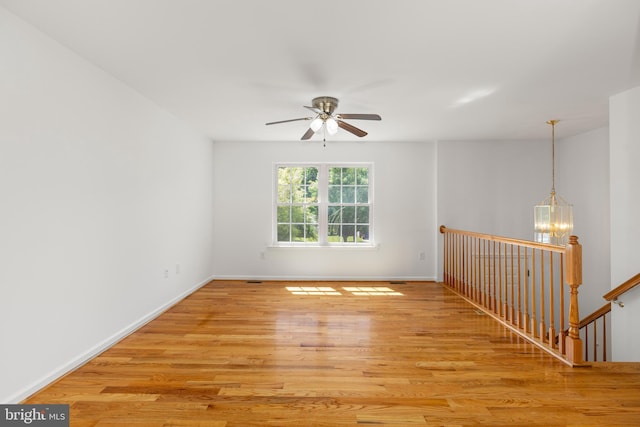 1118 Ashby St, Front Royal, VA 22630 - empty room with light wood-type flooring, ceiling fan, and baseboards