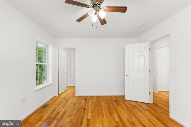 1118 Ashby St, Front Royal, VA 22630 - unfurnished bedroom with light wood-type flooring, baseboards, and a ceiling fan