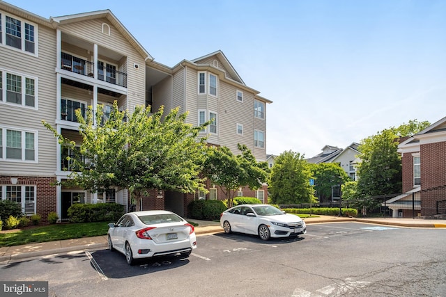 1530 Spring Gate Dr Unit 9308, Mclean, VA 22102 - view of building exterior featuring uncovered parking