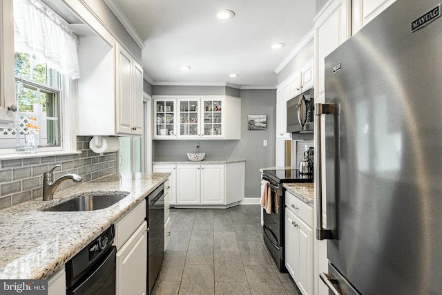 10 Garrett Rd, Wilmington, DE 19809 - kitchen with stainless steel appliances, a sink, ornamental molding, recessed lighting, and white cabinetry