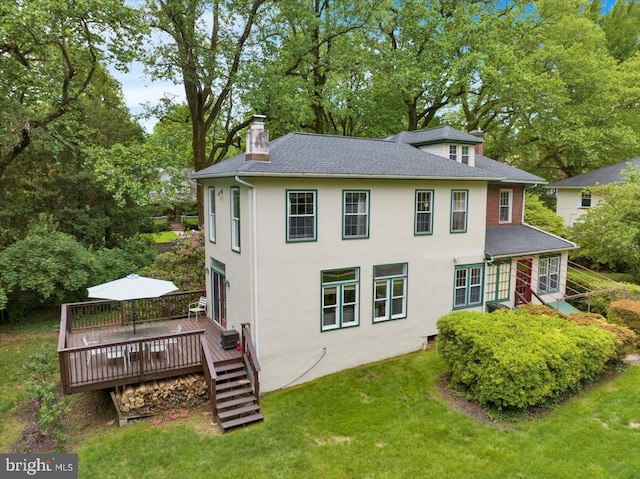61 Park Rd, Reading, PA 19609 - rear view of house with a chimney, a wooden deck, a yard, and view of scattered trees