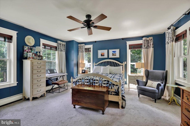 61 Park Rd, Reading, PA 19609 - bedroom featuring multiple windows, a baseboard heating unit, carpet, and a ceiling fan