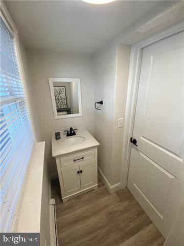 31 E Goepp St, Bethlehem, PA 18018 - bathroom featuring wood finished floors, vanity, and baseboards