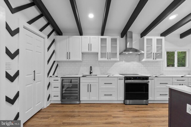 2761 Ebbvale Rd, Manchester, MD 21102 - kitchen featuring electric range, wine cooler, wall chimney exhaust hood, beam ceiling, and backsplash
