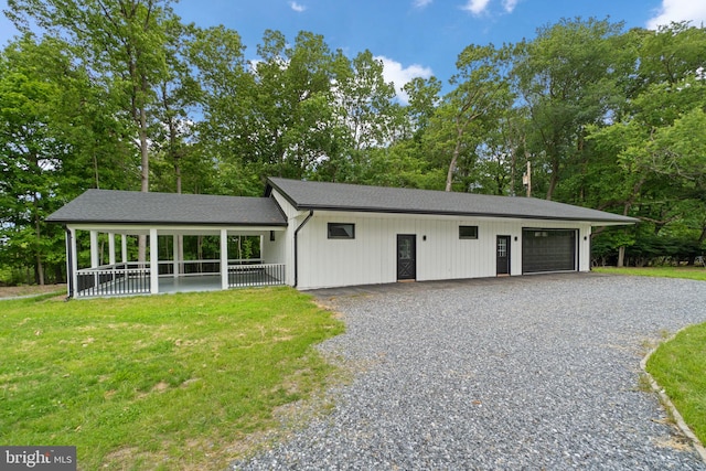 2761 Ebbvale Rd, Manchester, MD 21102 - garage featuring gravel driveway and view of scattered trees