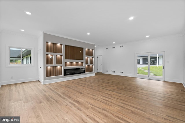 2761 Ebbvale Rd, Manchester, MD 21102 - unfurnished living room with crown molding, plenty of natural light, light wood-type flooring, recessed lighting, and baseboards