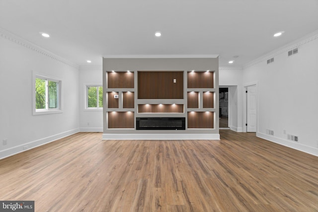 2761 Ebbvale Rd, Manchester, MD 21102 - unfurnished living room featuring ornamental molding, wood finished floors, baseboards, recessed lighting, and a glass covered fireplace