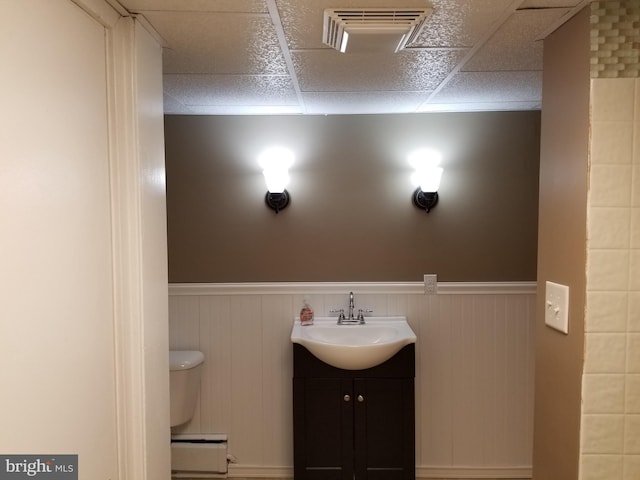 1320 Oak Ln, New Cumberland, PA 17070 - half bath with toilet, a drop ceiling, wainscoting, and vanity