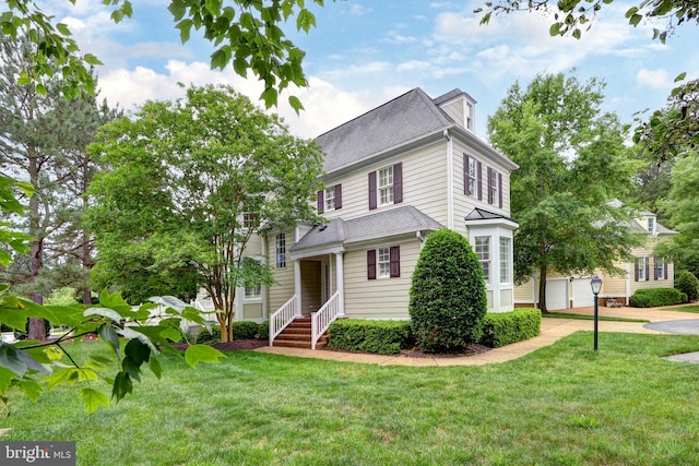 3609 Bradinton, Williamsburg, VA 23188 - american foursquare style home with driveway, a front yard, and a detached garage