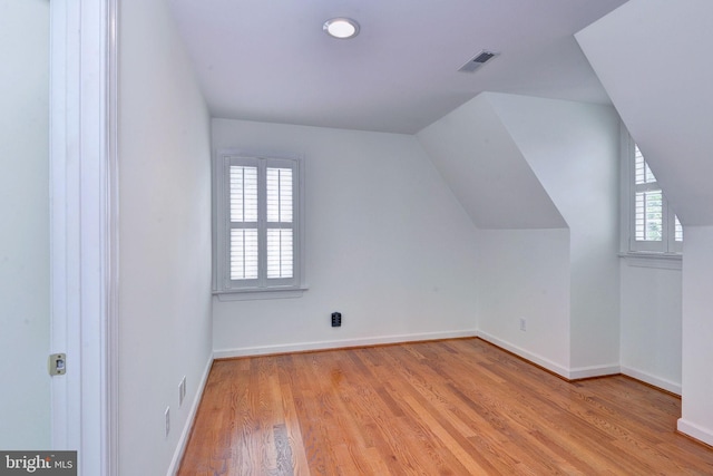 3609 Bradinton, Williamsburg, VA 23188 - additional living space featuring plenty of natural light, light wood finished floors, baseboards, and lofted ceiling