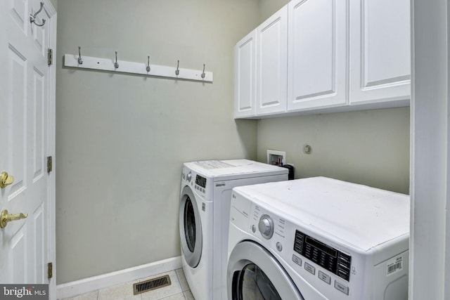 3609 Bradinton, Williamsburg, VA 23188 - washroom with cabinet space, washing machine and clothes dryer, tile patterned floors, and baseboards