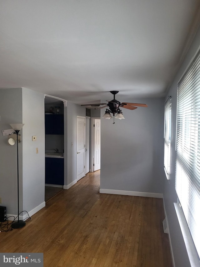 4410 Falls Bridge Dr Unit H, Baltimore, MD 21211 - unfurnished room with a ceiling fan, wood finished floors, baseboards, and a sink