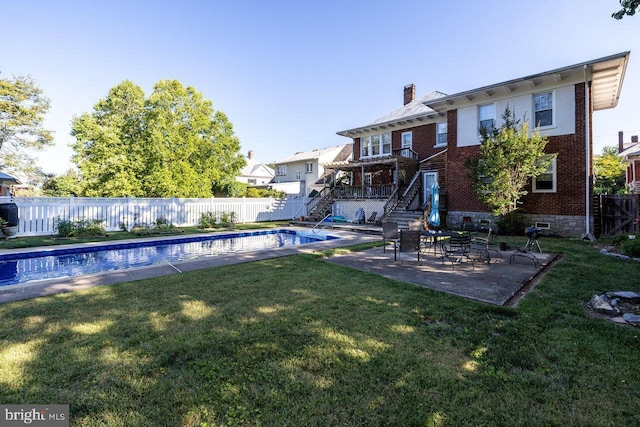289 Newman Ave, Harrisonburg, VA 22801 - rear view of house featuring stairs, brick siding, a chimney, and a patio area
