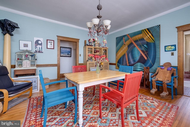 289 Newman Ave, Harrisonburg, VA 22801 - dining area featuring wood finished floors, a chandelier, and ornamental molding