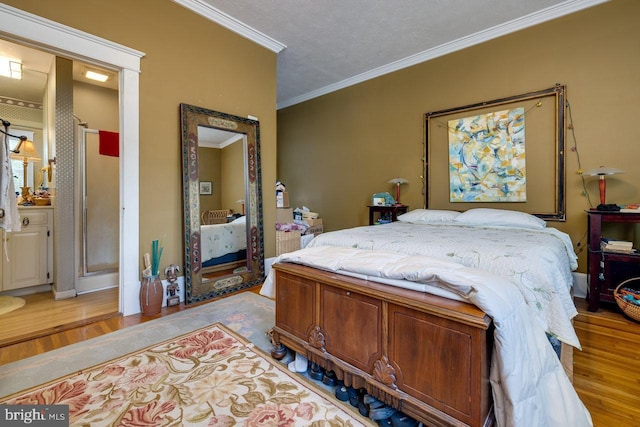 289 Newman Ave, Harrisonburg, VA 22801 - bedroom with light wood-style flooring, crown molding, and baseboards