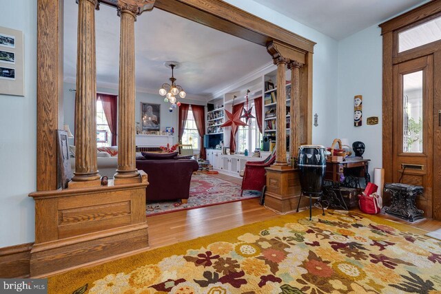 289 Newman Ave, Harrisonburg, VA 22801 - foyer featuring ornate columns, wood finished floors, a chandelier, and crown molding