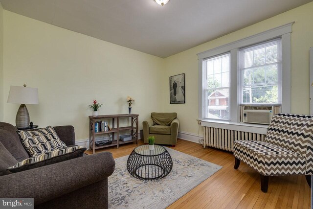 289 Newman Ave, Harrisonburg, VA 22801 - sitting room featuring radiator, wood finished floors, baseboards, and cooling unit