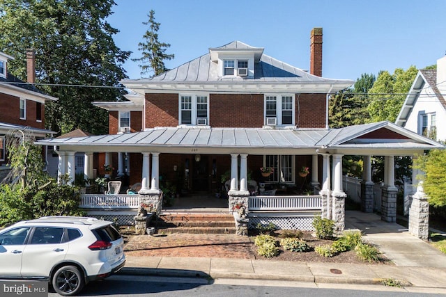 289 Newman Ave, Harrisonburg, VA 22801 - american foursquare style home with a standing seam roof, covered porch, brick siding, and metal roof