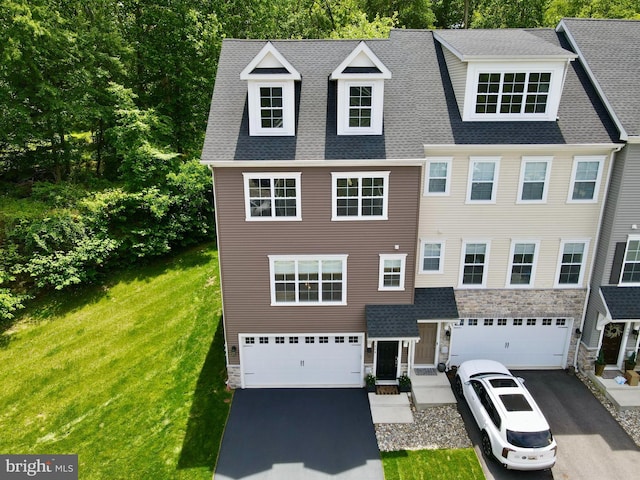 404 Rock Run Cir, Broomall, PA 19008 - view of front of home featuring stone siding, driveway, an attached garage, and a front lawn
