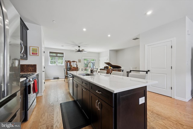 404 Rock Run Cir, Broomall, PA 19008 - kitchen with stainless steel appliances, a sink, light wood-type flooring, light countertops, and recessed lighting