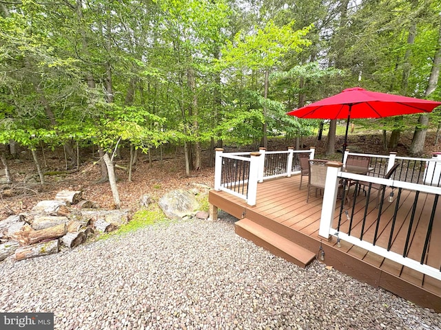 wooden deck featuring outdoor dining area