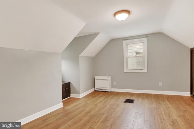 322 S Progress Ave, Harrisburg, PA 17109 - additional living space featuring heating unit, light wood-style floors, lofted ceiling, and baseboards
