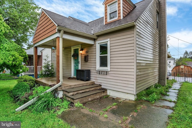 322 S Progress Ave, Harrisburg, PA 17109 - view of front of property with covered porch and a shingled roof