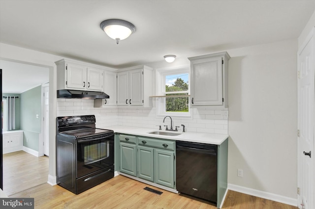 322 S Progress Ave, Harrisburg, PA 17109 - kitchen with black appliances, a sink, light countertops, and tasteful backsplash
