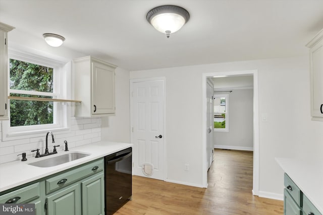322 S Progress Ave, Harrisburg, PA 17109 - kitchen featuring dishwasher, a sink, green cabinetry, and light countertops