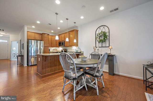 42 Cresthaven Ln, Dover, DE 19901 - dining area with dark wood-style floors, recessed lighting, and baseboards