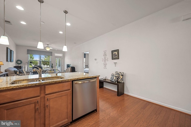 42 Cresthaven Ln, Dover, DE 19901 - kitchen featuring stainless steel dishwasher, a sink, hardwood / wood-style flooring, brown cabinets, and recessed lighting