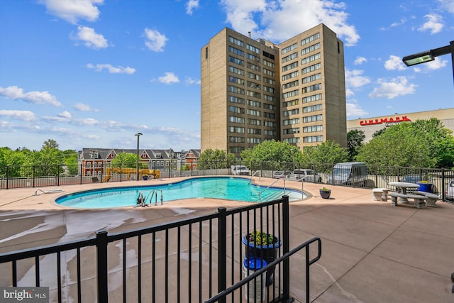 205 E Joppa Rd Unit 403, Baltimore, MD 21286 - community pool featuring a patio
