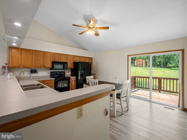 979 John Brown Farm Rd, Harpers Ferry, WV 25425 - kitchen with black appliances, a sink, a ceiling fan, a peninsula, and light wood finished floors