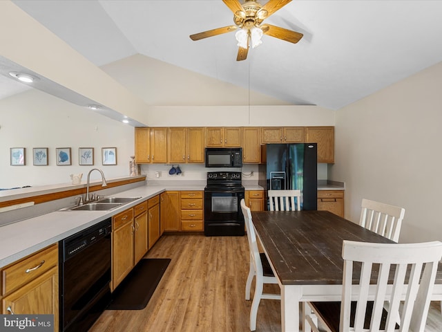 979 John Brown Farm Rd, Harpers Ferry, WV 25425 - kitchen featuring black appliances, a sink, vaulted ceiling, light countertops, and light wood finished floors