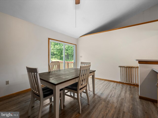 979 John Brown Farm Rd, Harpers Ferry, WV 25425 - dining space with lofted ceiling, radiator, wood finished floors, and baseboards