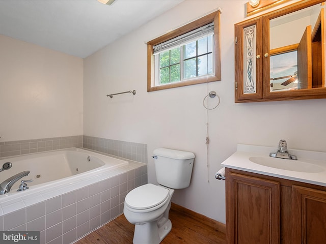 979 John Brown Farm Rd, Harpers Ferry, WV 25425 - bathroom with toilet, a whirlpool tub, vanity, wood finished floors, and baseboards