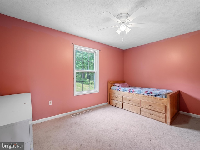 979 John Brown Farm Rd, Harpers Ferry, WV 25425 - bedroom featuring baseboards, carpet, a textured ceiling, and a ceiling fan