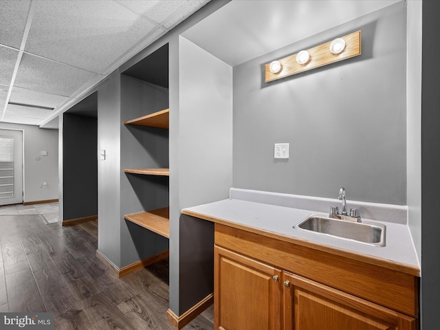 979 John Brown Farm Rd, Harpers Ferry, WV 25425 - bar area featuring a sink, dark wood-style flooring, a paneled ceiling, and baseboards