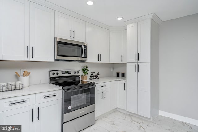 2017 Fairlane Rd, Bel Air, MD 21015 - kitchen with appliances with stainless steel finishes, light marble finish floors, recessed lighting, light countertops, and white cabinets