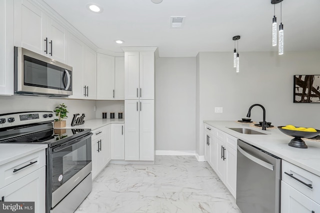 2017 Fairlane Rd, Bel Air, MD 21015 - kitchen featuring appliances with stainless steel finishes, a sink, light marble finish flooring, light countertops, and white cabinetry