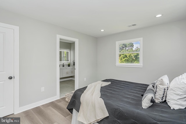 2017 Fairlane Rd, Bel Air, MD 21015 - bedroom featuring multiple windows, wood finished floors, recessed lighting, baseboards, and ensuite bathroom